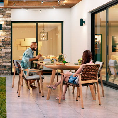 Sliding patio doors opening onto an outdoor dining area